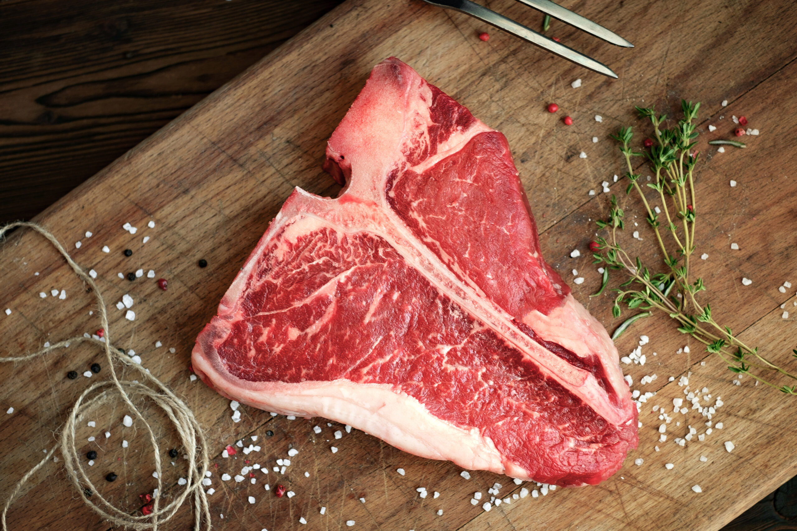 raw t bone steak on wooden Board rustic style Image placeholder indicating a photo is needed, typically used in web design or content management systems to signal missing visual content.